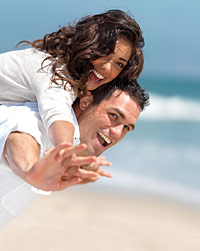 a happy couple on the Santoniri sand